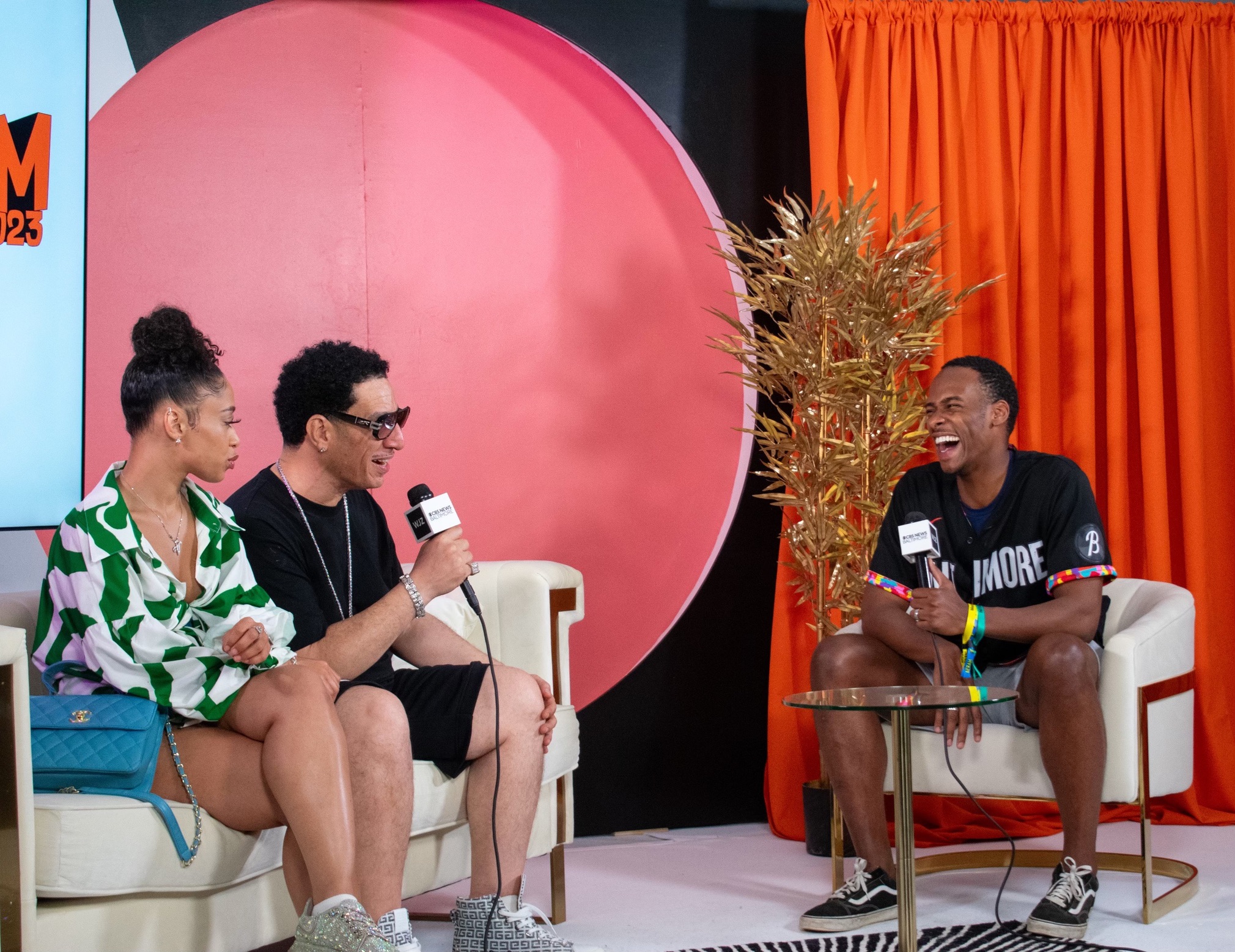 Stephon Dingle laughs during an onstage conversation at Baltimore AFRAM.