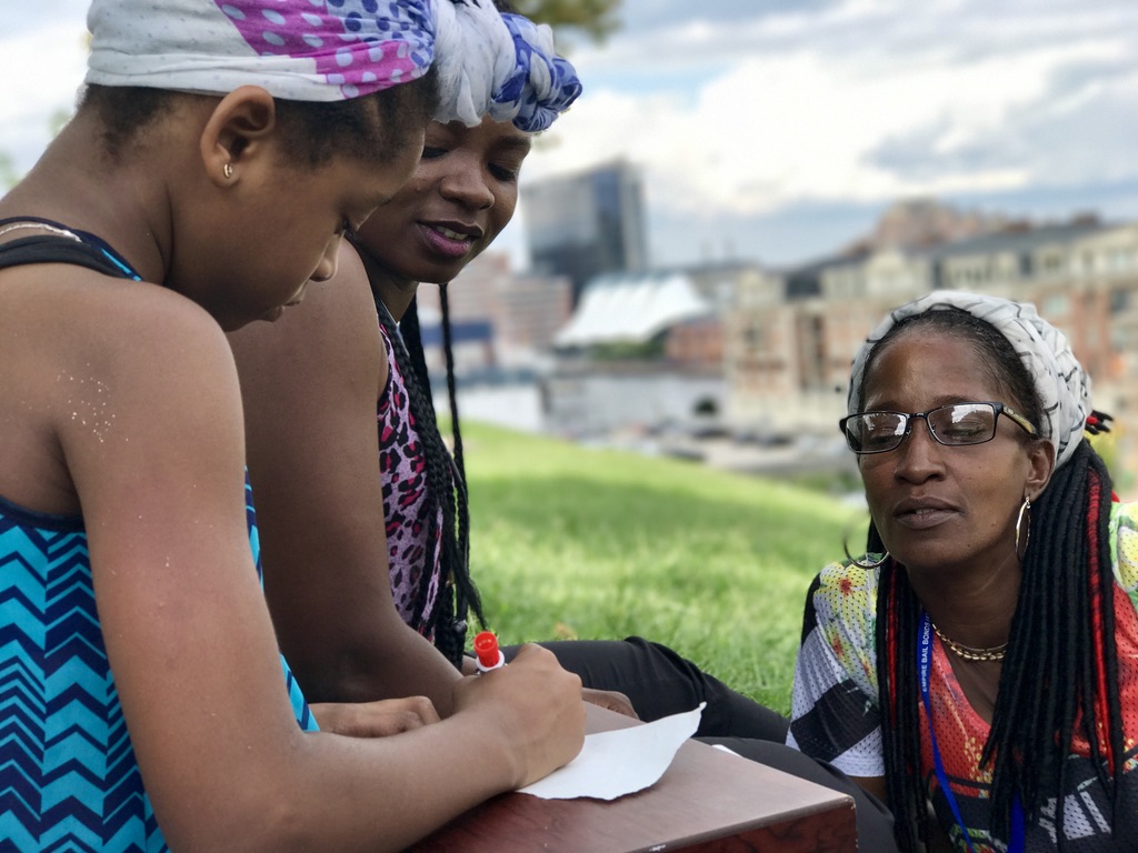 Yulawnda, Jasmine and Jahniya together across three generations at a family picnic.