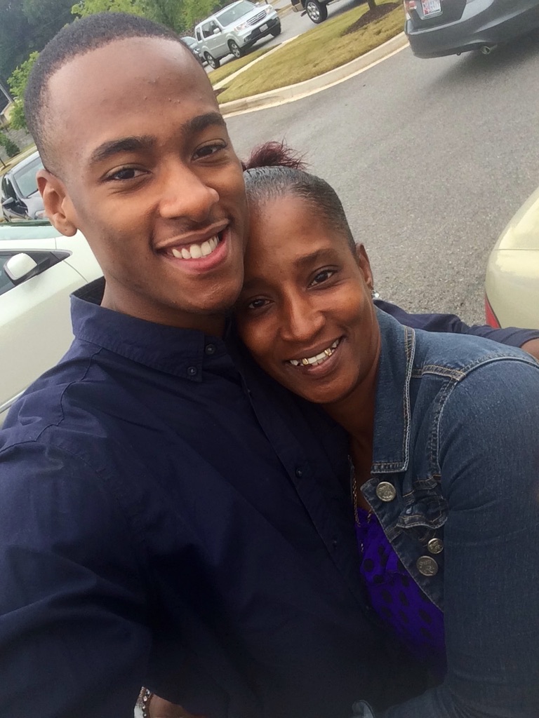 Stephon Dingle smiles in a close portrait with his mother, Yulawnda.