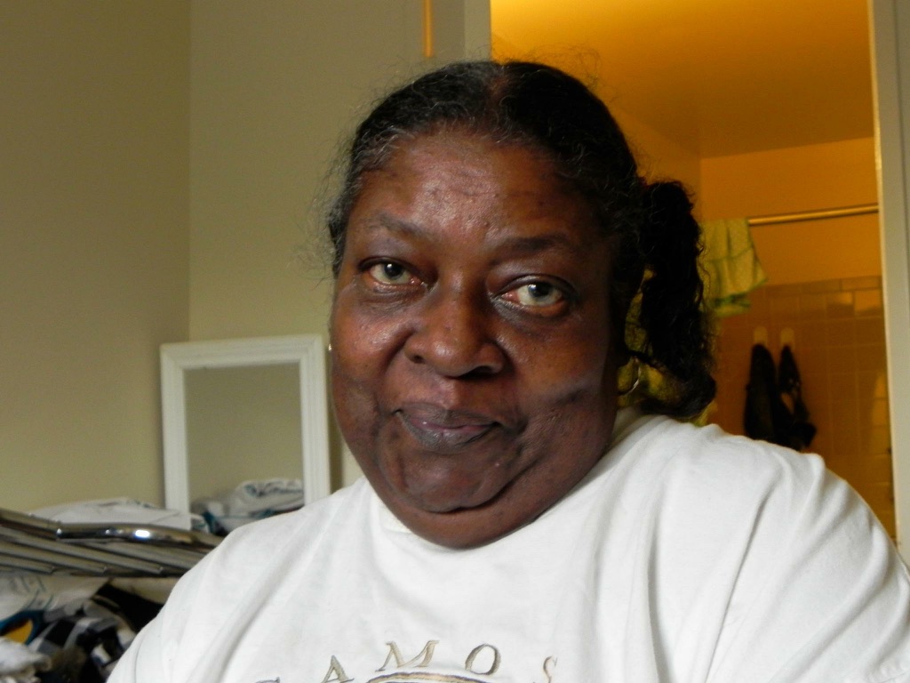 Portrait of Ms. Sheila Plato, Stephon Dingle’s grandmother, seated indoors.