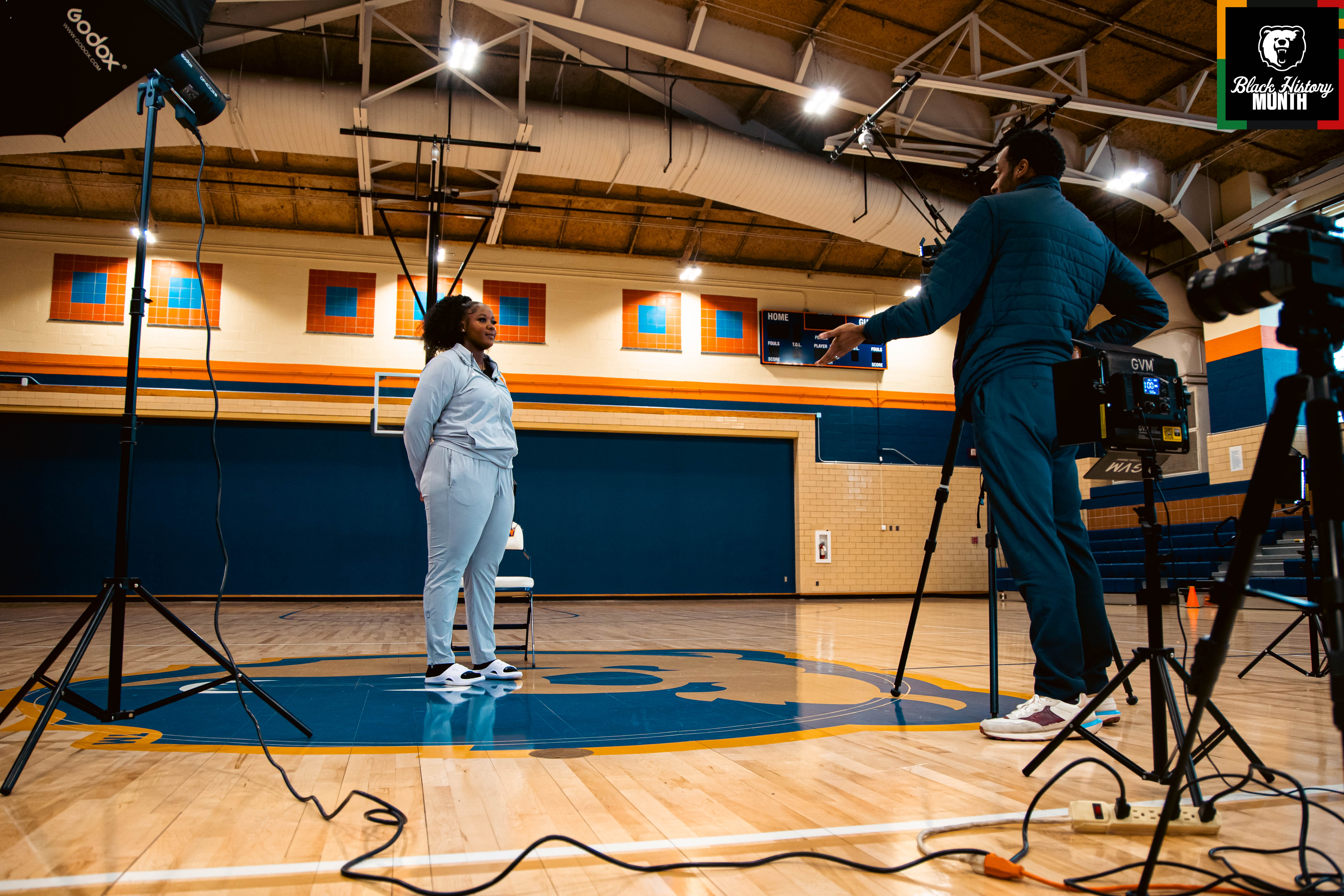 Stephon Dingle interviewing a Morgan State University acrobatics and tumbling athlete