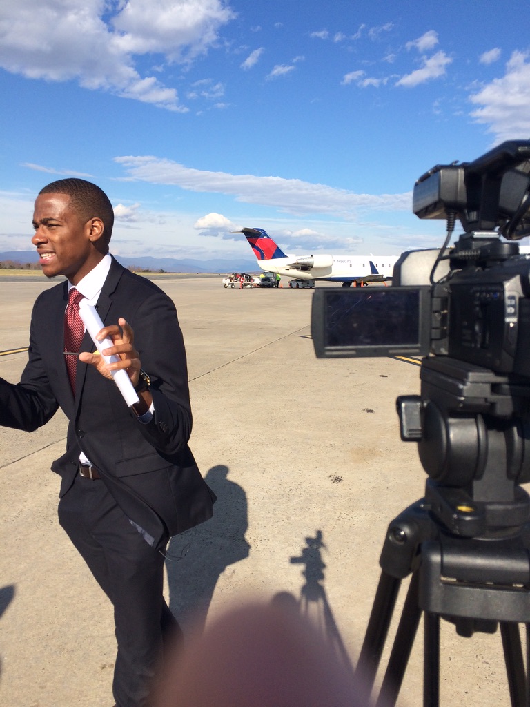 Stephon Dingle reporting from an airport tarmac during his Charlottesville years.