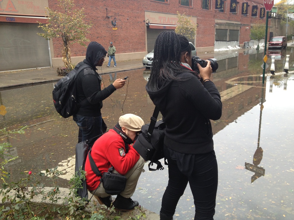 Stephon Dingle’s J-school classmates Matthew, Jason, and Salima documenting a flooded New York street during Superstorm Sandy.