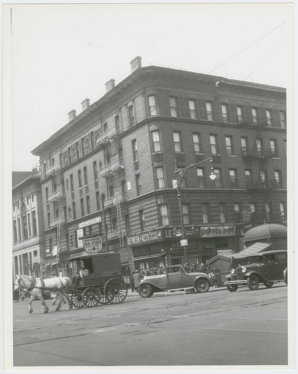 Archival view of Lenox Avenue at West 135th Street in Harlem during the 1920s.