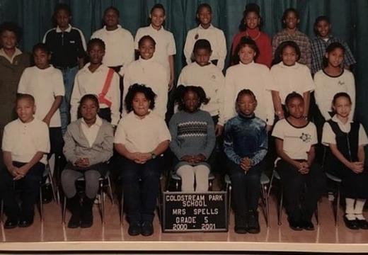 Stephon Dingle centered in the back row of his fifth-grade class at Coldstream Park Elementary School in 2000.