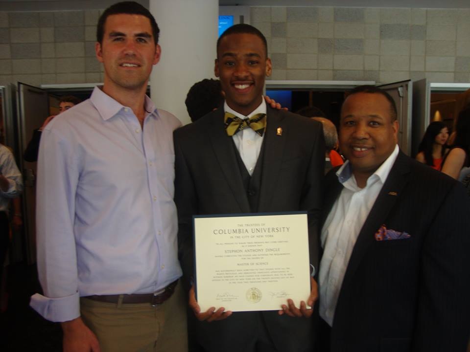 Stephon Dingle holding his Columbia degree between mentors Rob Paymer and Steven King.