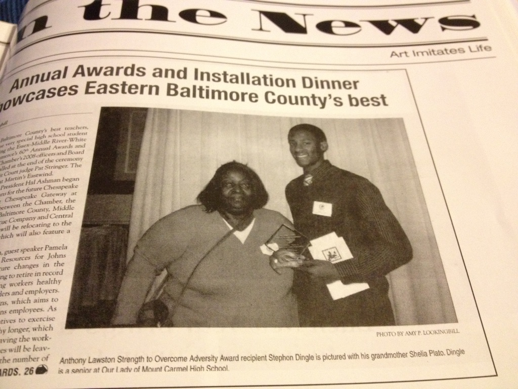 Stephon Dingle beside his grandmother Sheila in a newspaper feature recognizing his Anthony Lawston Strength to Overcome Adversity Award.