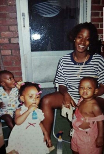 Stephon Dingle as a toddler with his mother at a family birthday party in 1991.