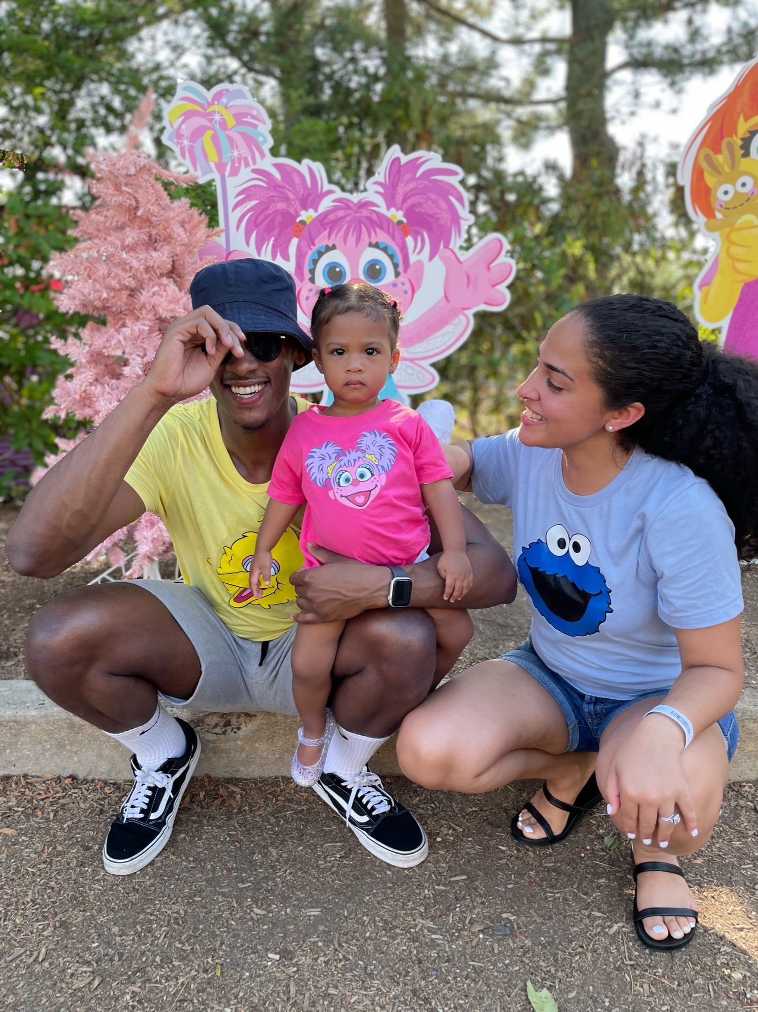 Stephon Dingle with his wife and their daughter Devyn during a family outing.